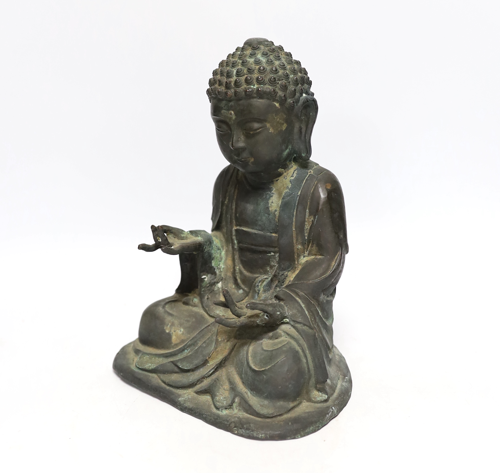 A Chinese bronze figure of Buddha Shakyamuni, Ming style, 25cm high